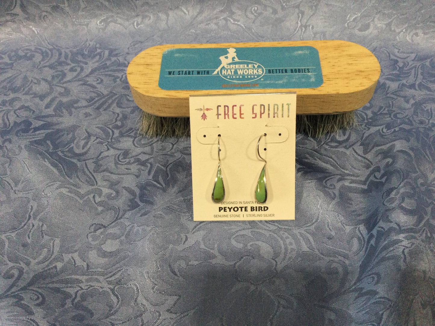 Photo of the Green Turquoise Raindrop Dangle Earrings from Free Spirit by Peyote Bird Earrings sold by Greeley Hat Works