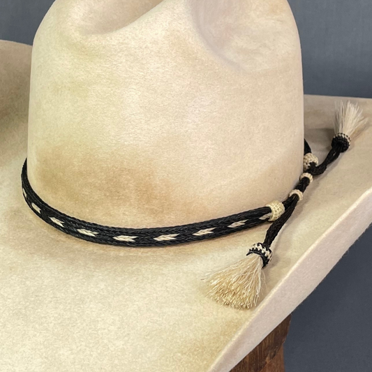 Photo of a horsehair cowboy hat band that was worn by John Dutton in the hit series Yellowstone, available for purchase from Greeley Hat Works