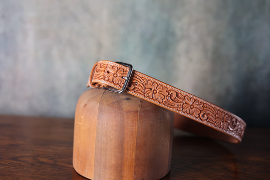Photo of the Texas Saddlery Hand Tooled Leather Tan Floral Belt sold by Greeley Hat Works with silver buckle