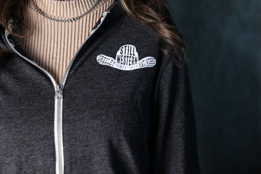 Close-up photo of the grey Still Western Zip-up Hoodie from Greeley Hat works