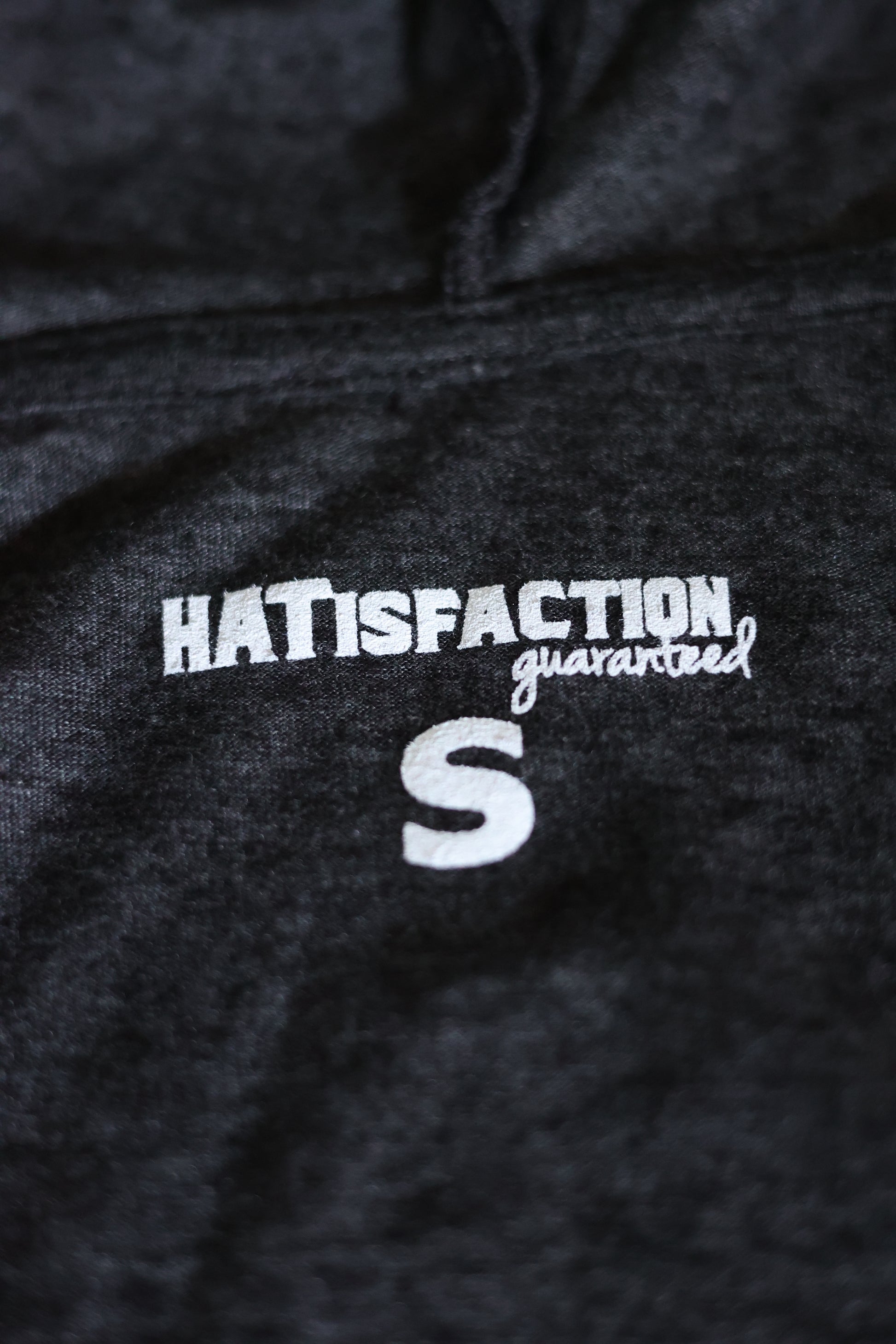 Photo of the HATisfaction Guaranteed embroidering on the Still Western Zip-up Hoodie from Greeley Hat Works