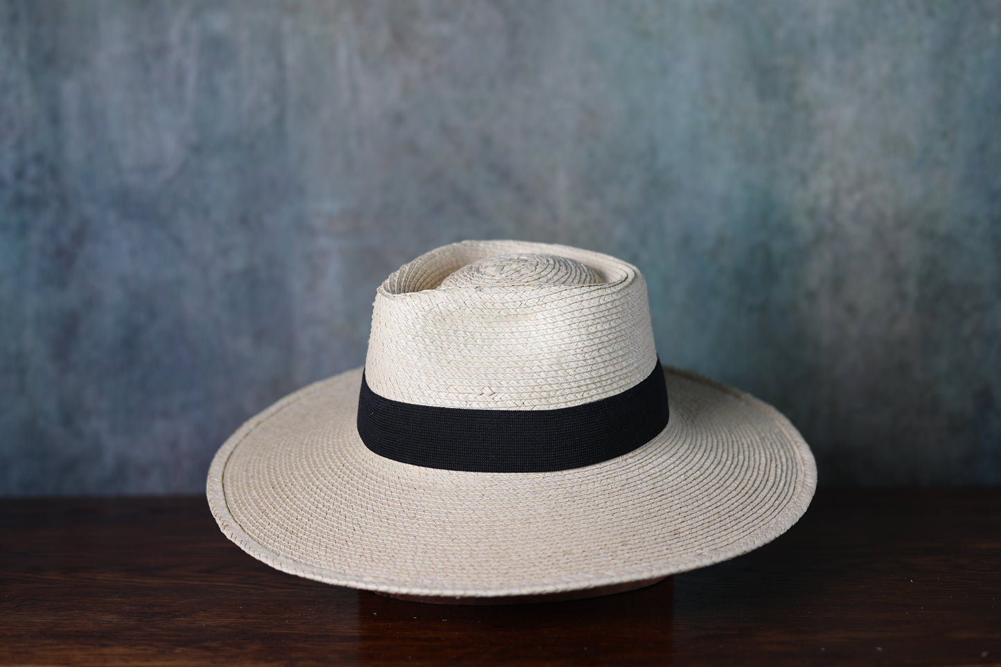 Photo of the side of a SunBody Casa Blanca Palm Leaf straw hat with black band from Greeley Hat Works