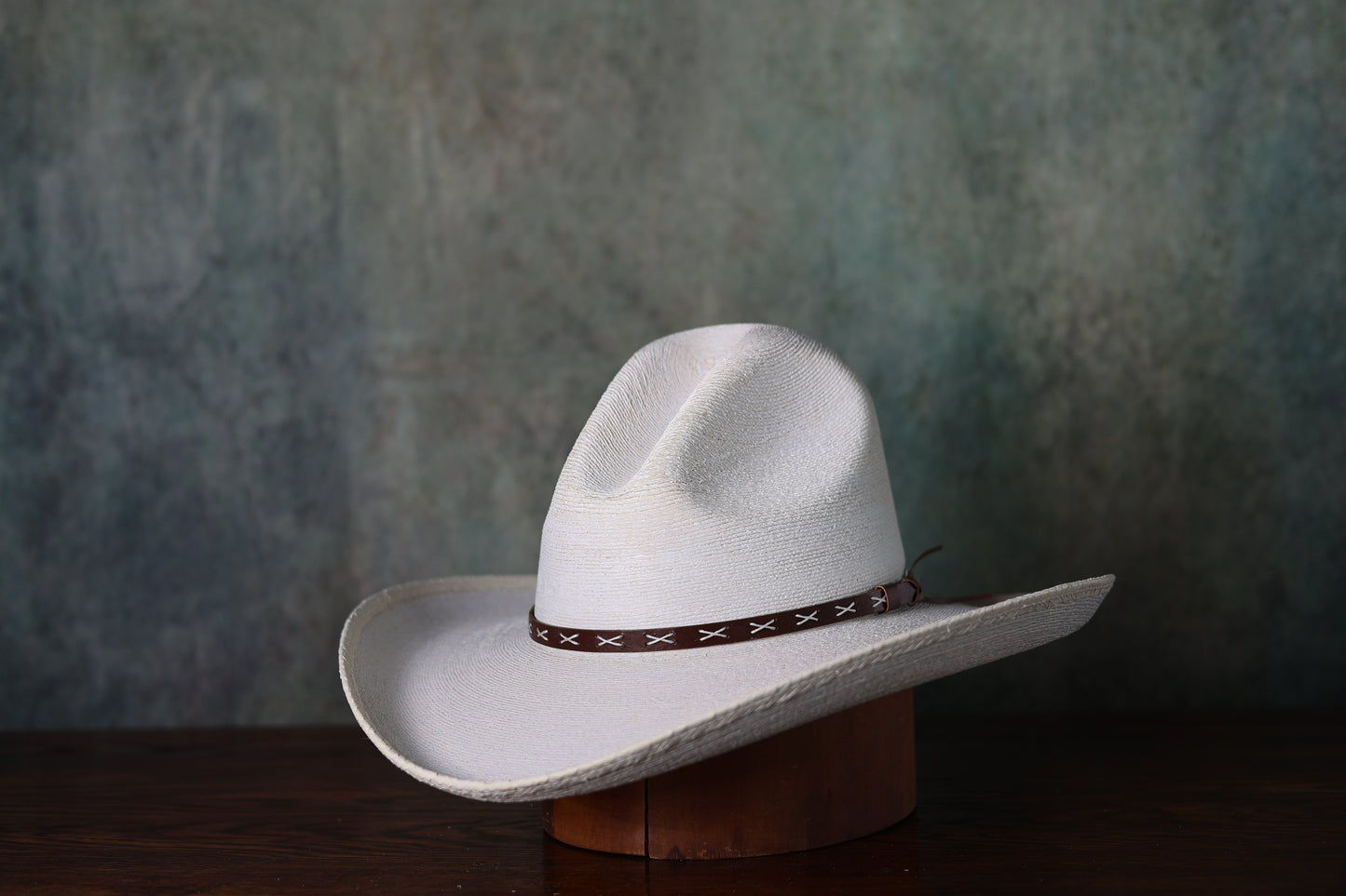 Photo of white SunBody Mexican Fine Palm Gus straw hat from Greeley Hat Works with brown leather band