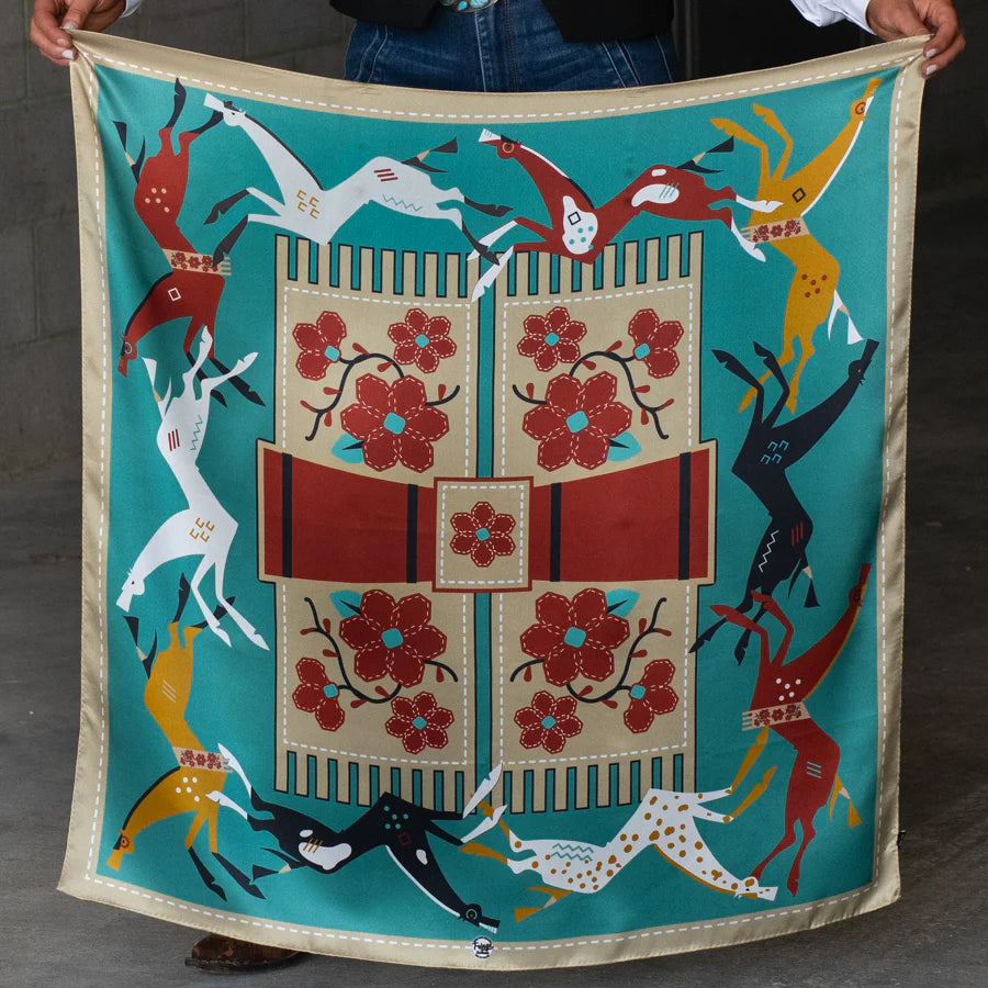 Colorful Fringe Scarves Wild Rag from Greeley Hat Works with aztec style hroses and floral patterns held by a person.