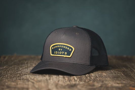 Surrounded By Idiots Cap