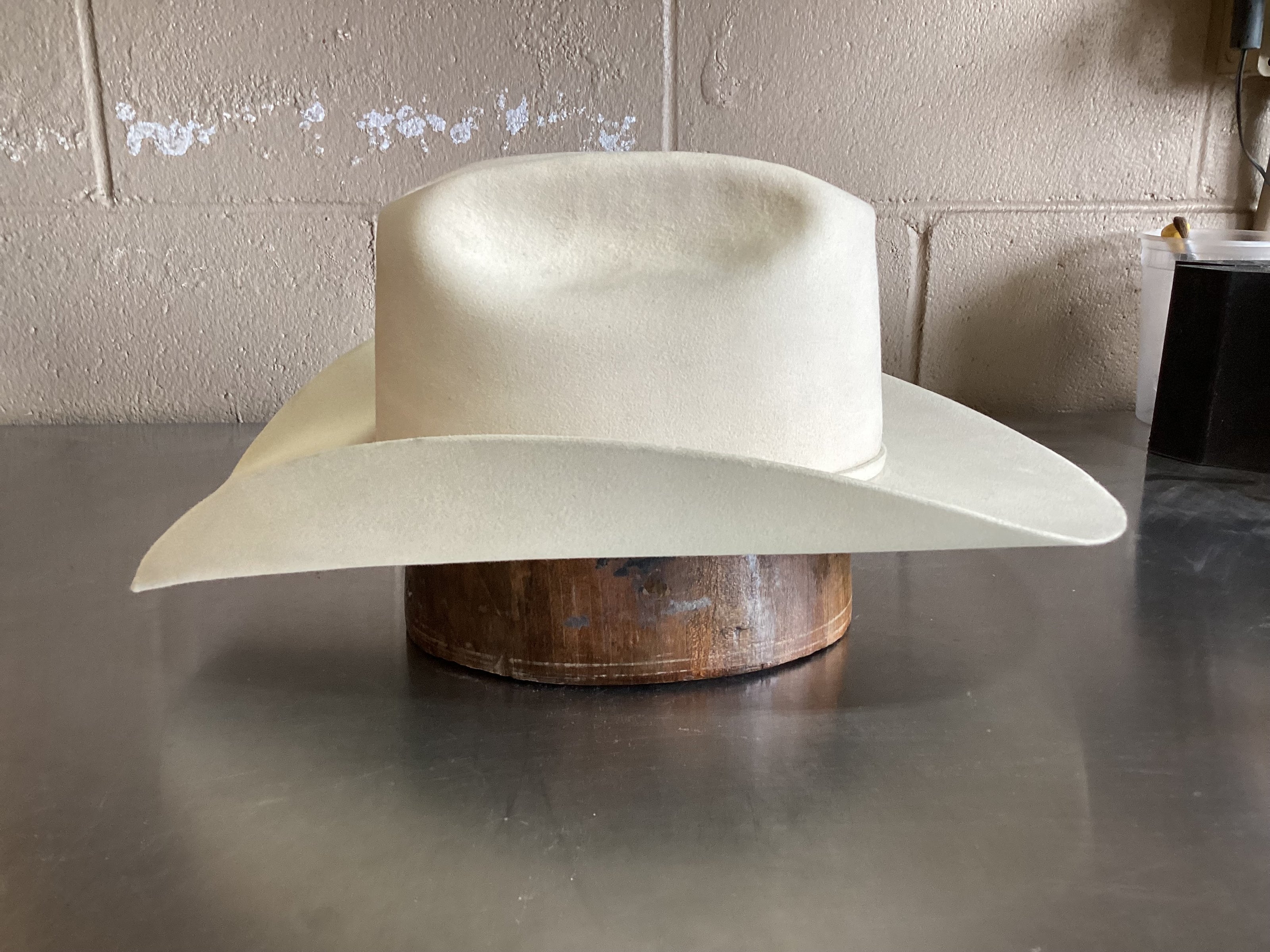 Side photo of white felt cowboy hat after ReCraft services from Greeley Hat Works