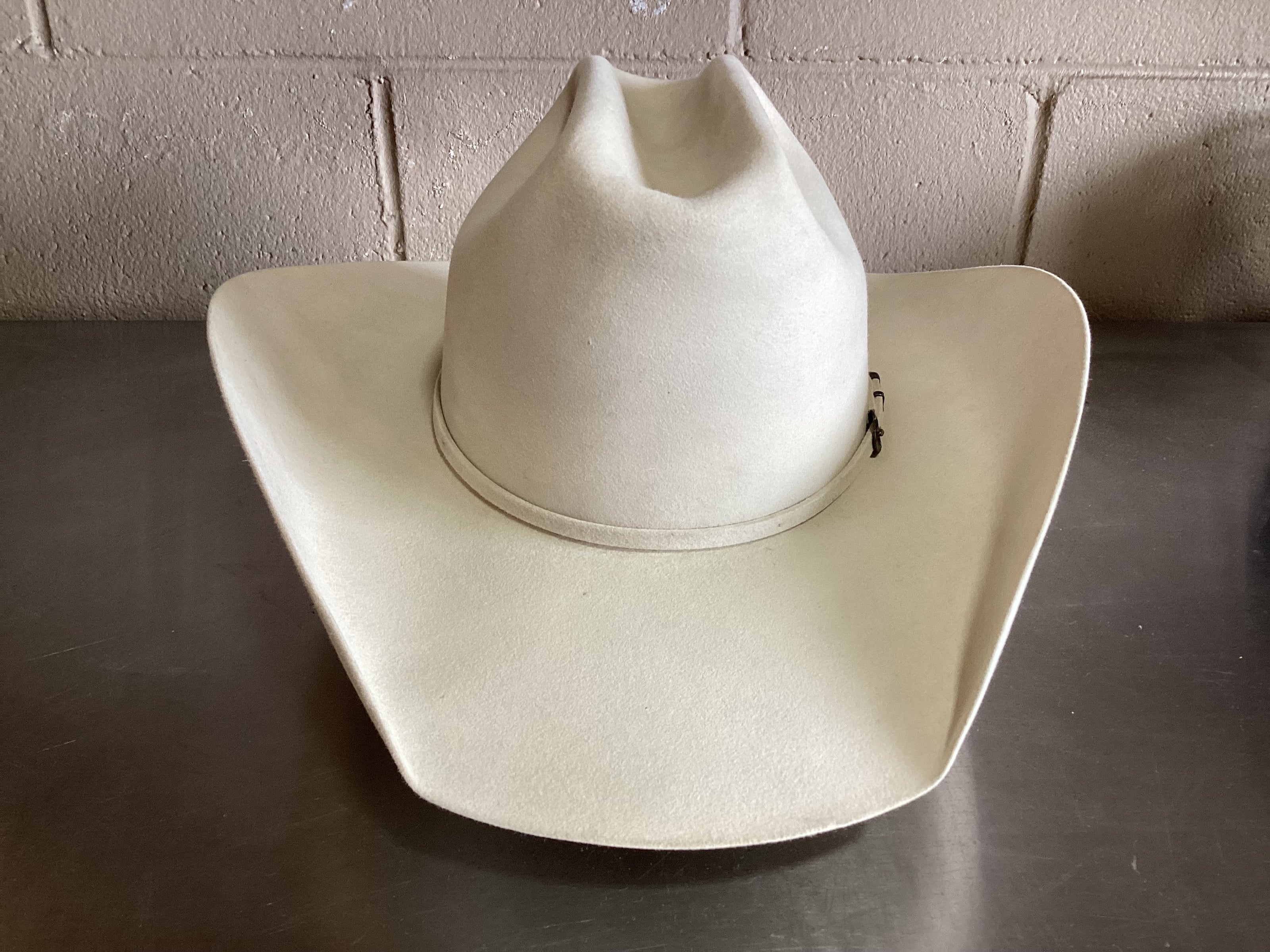 Front photo of white felt cowboy hat after ReCraft services from Greeley Hat Works
