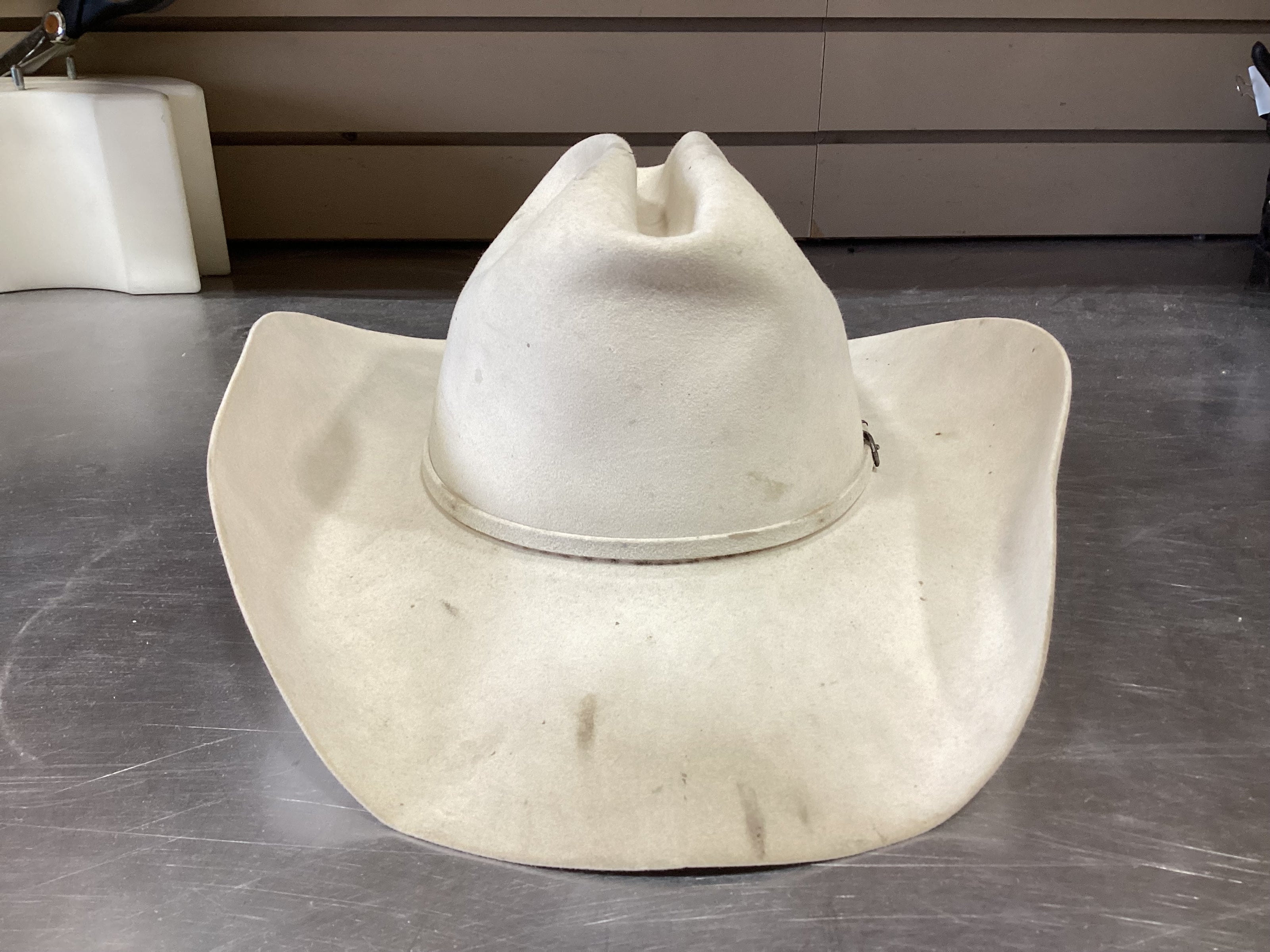 Front photo of cream-colored cowboy hat prior to ReCraft services from Greeley Hat Works