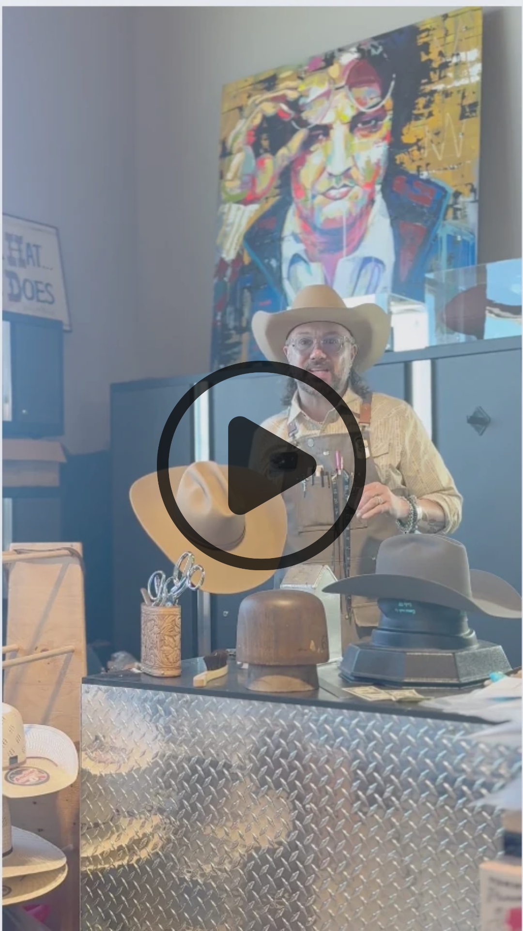Man Steaming a Hat In Cowboy Hat